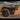 A tan 5th Gen 4Runner equipped with a C4 Overland bumper with full-height bull bar and headlight hoops.